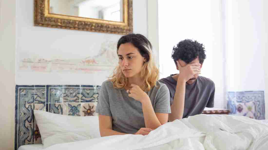 An unhappy couple ignoring each other