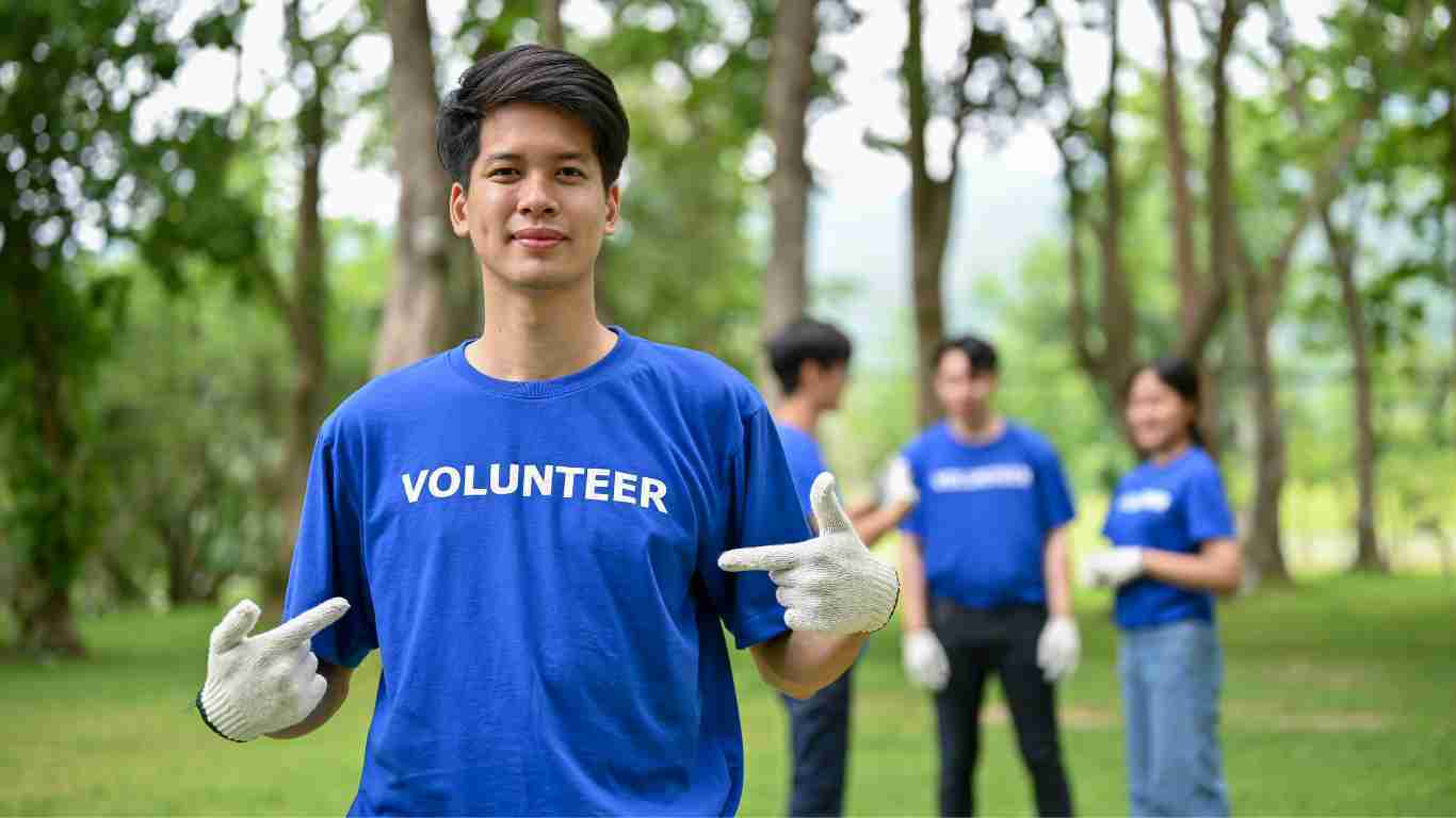 A man drawing attention to the fact that he is volunteering