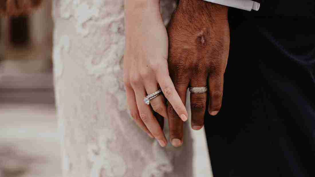 Hands wearing wedding rings
