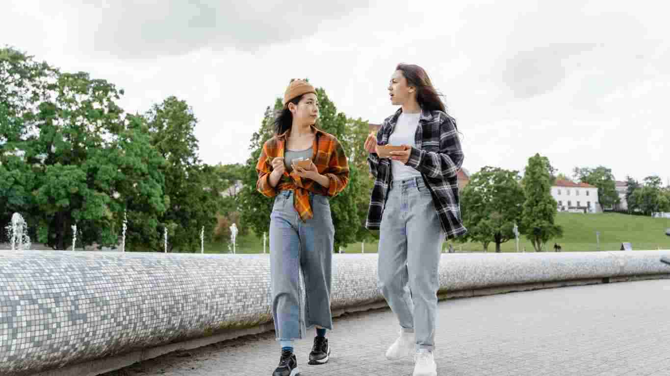 Two friends walking and talking