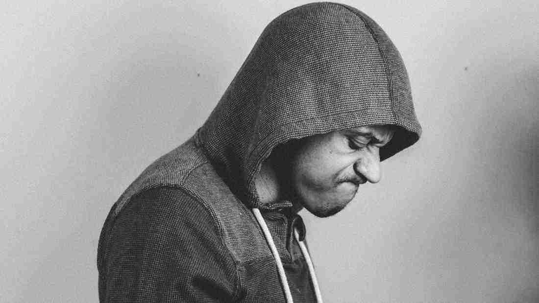 An angry man wearing a hoody