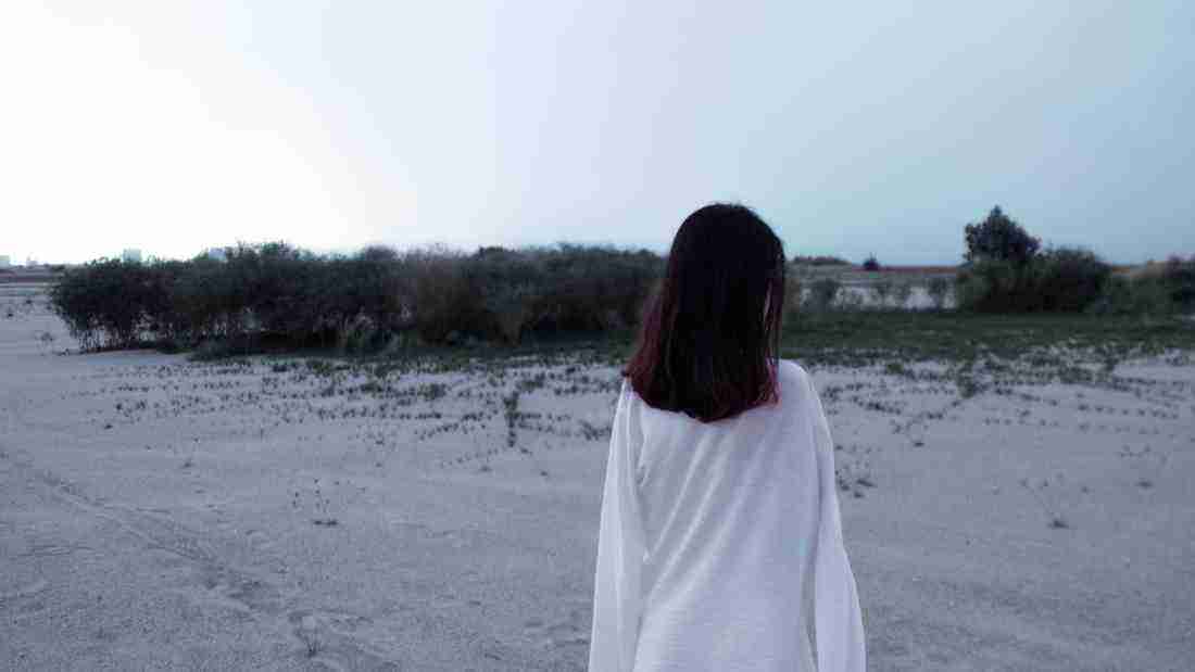 A lonely woman at the beach