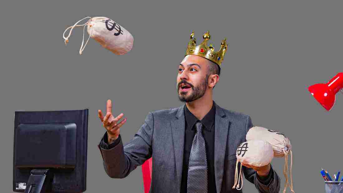 A man wearing a crown and showing off how rich he is