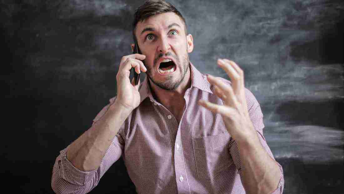 A man in the middle of a fit of rage