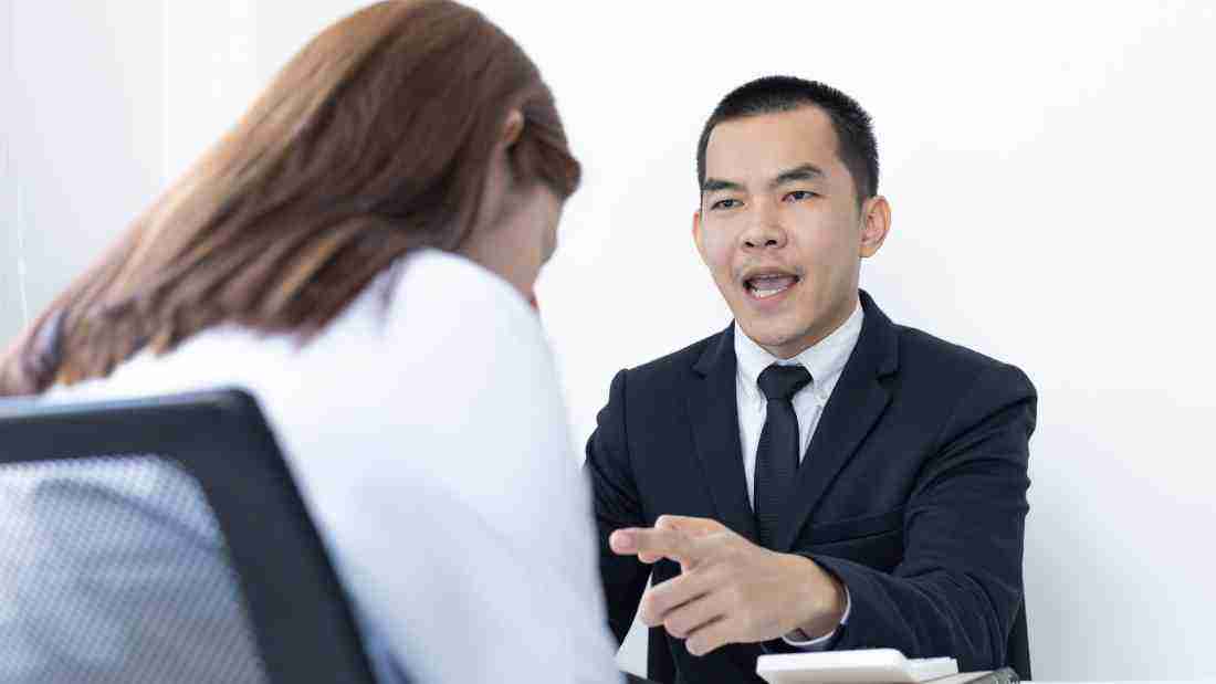 A boss shouting at an employee