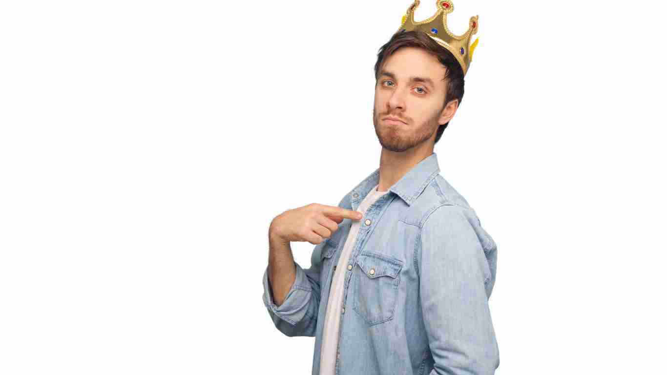 A man wearing a golden crown, symbolizing his self-importance