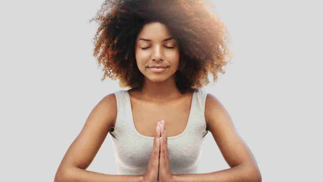 A woman sitting quietly and meditating