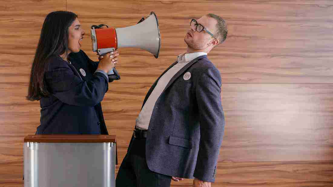 A woman screaming into a megaphone