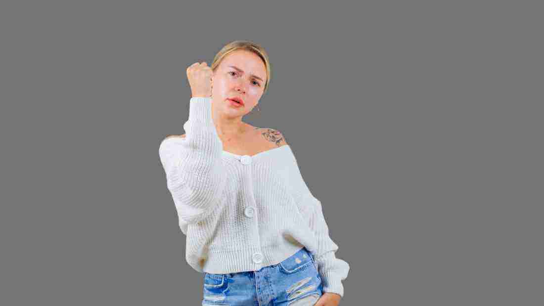 An woman making aggressive hand gestures