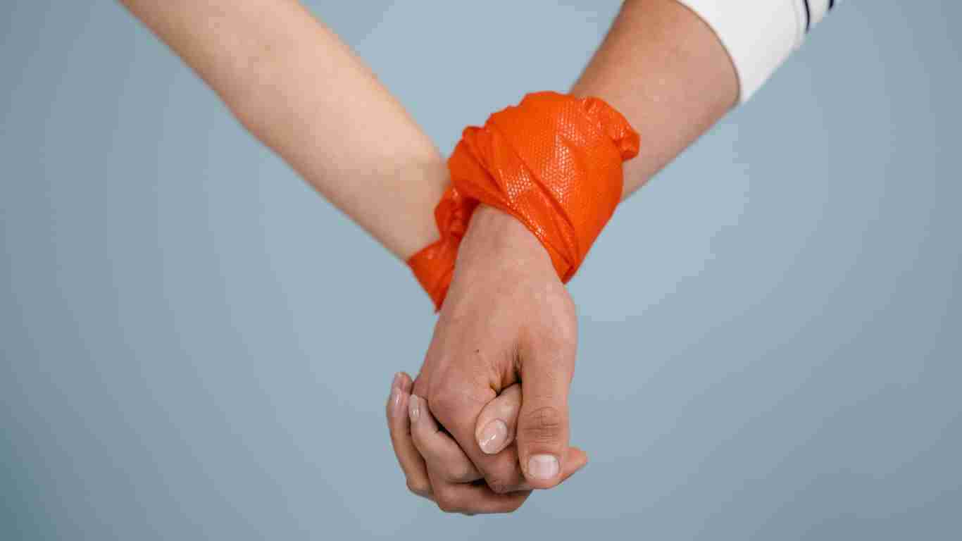 A couple tied together, symbolizing a codependent relationship