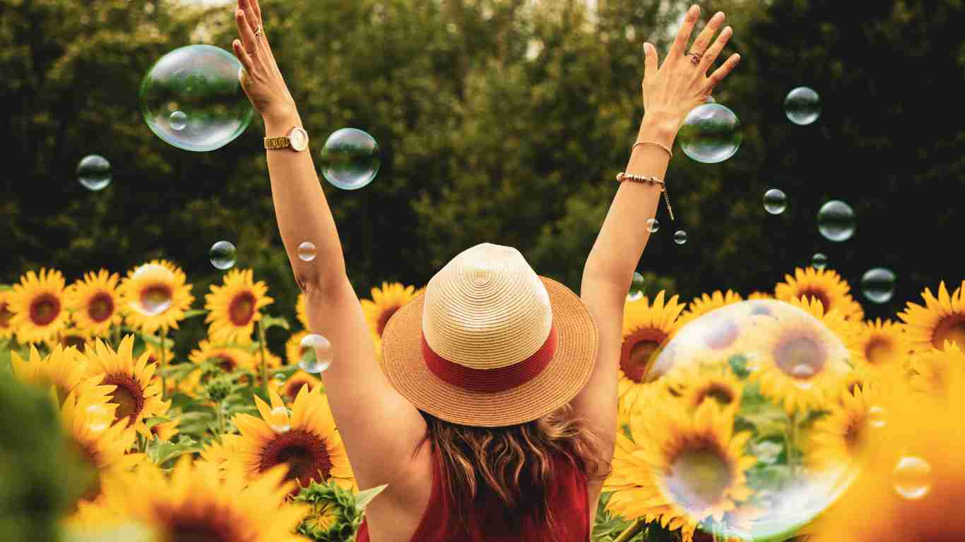 A woman running through a field of sunflowers, symbolizing the joy of freedom