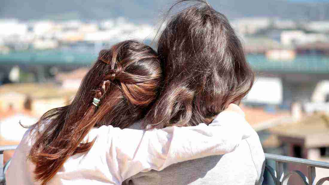 Two friends embracing
