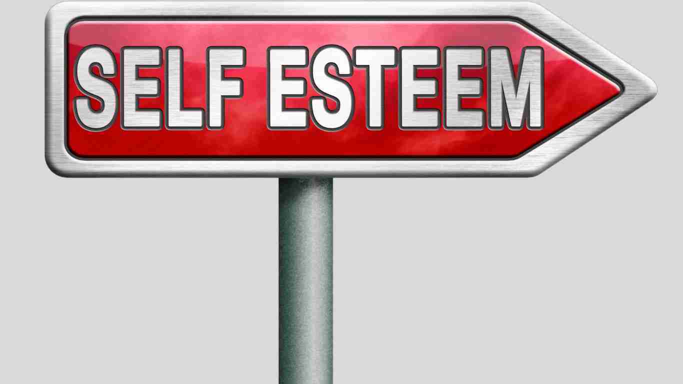 A road sign pointing to SELF ESTEEM