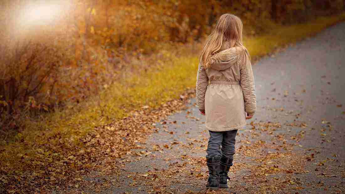 A woman walking away from the camera