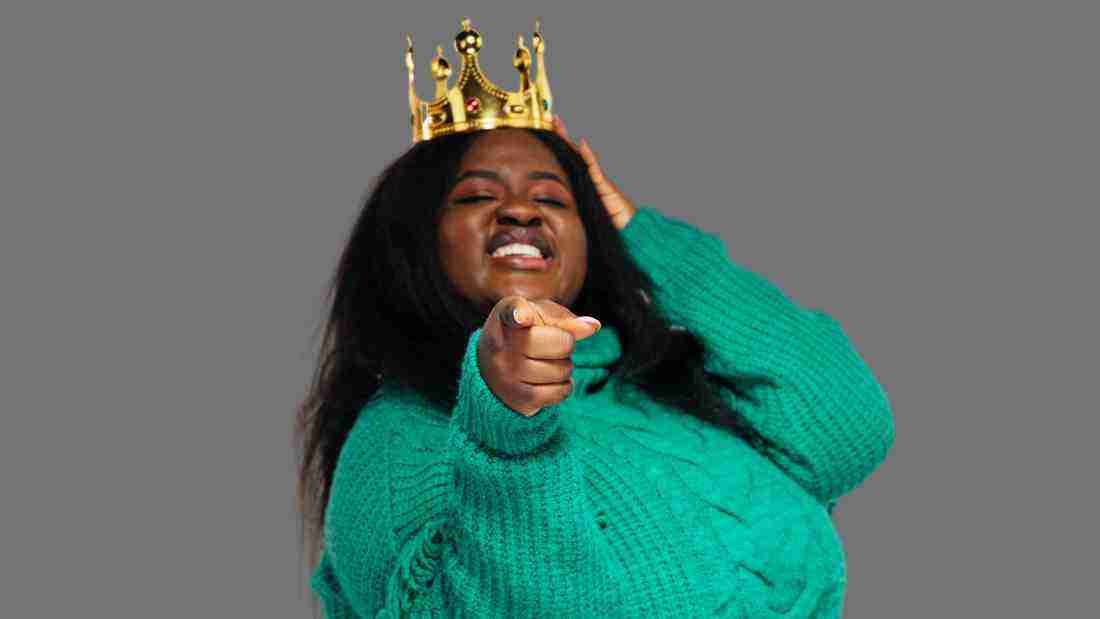 A woman wearing a crown, signifying her narcissism