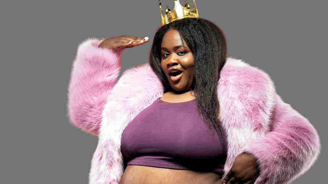 A woman showing off for the camera. Her crown symbolizes her strong narcissistic tendencies