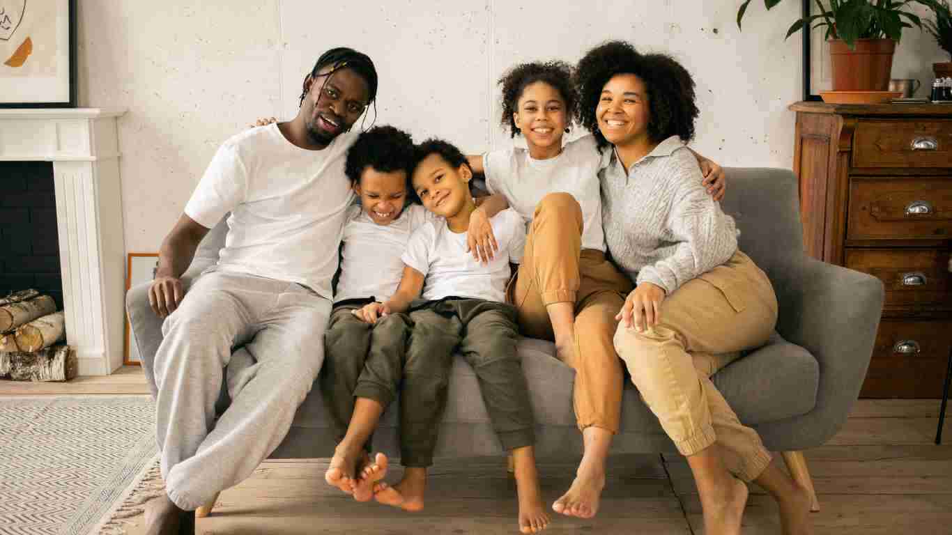 A big happy family cuddling on the sofa