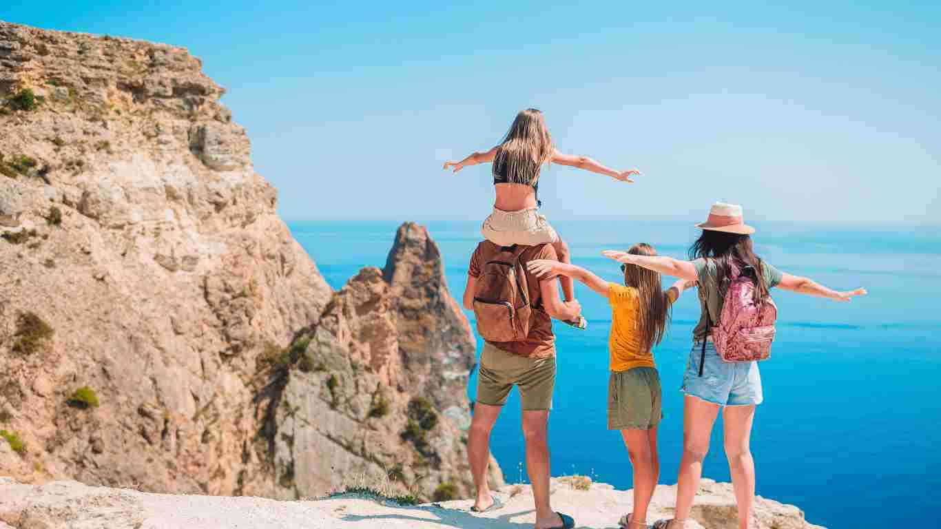 A family enjoying themselves on holiday at the beach