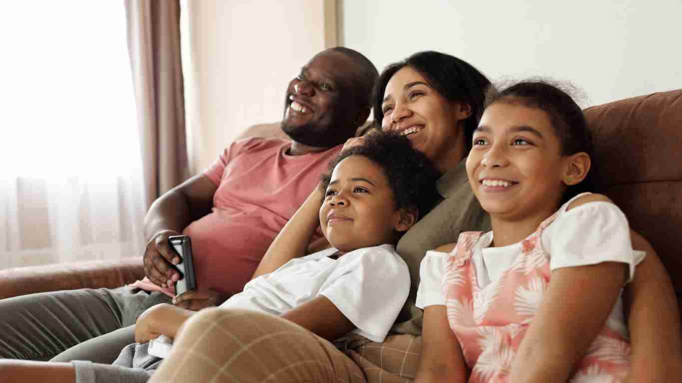 A family watching TV together