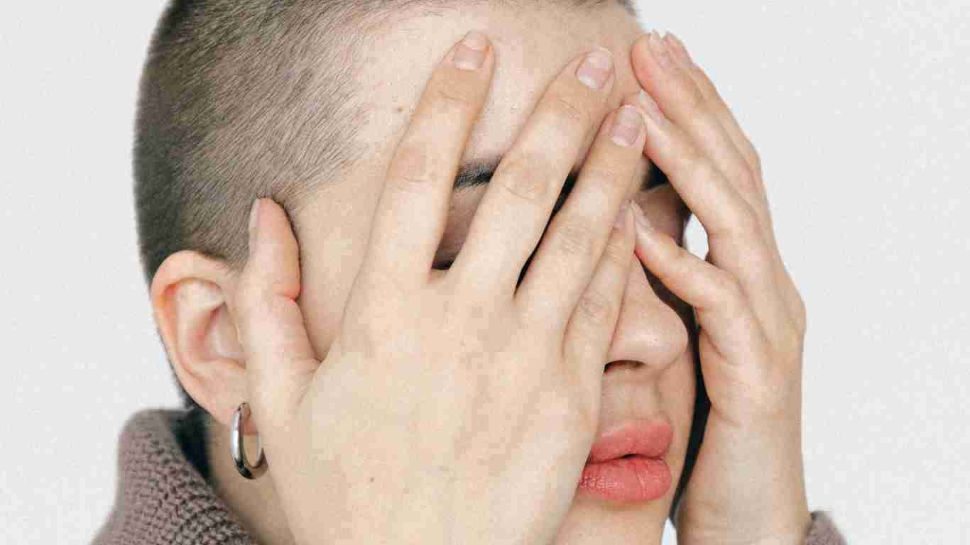 A woman who looks totally overwhelmed and helpless