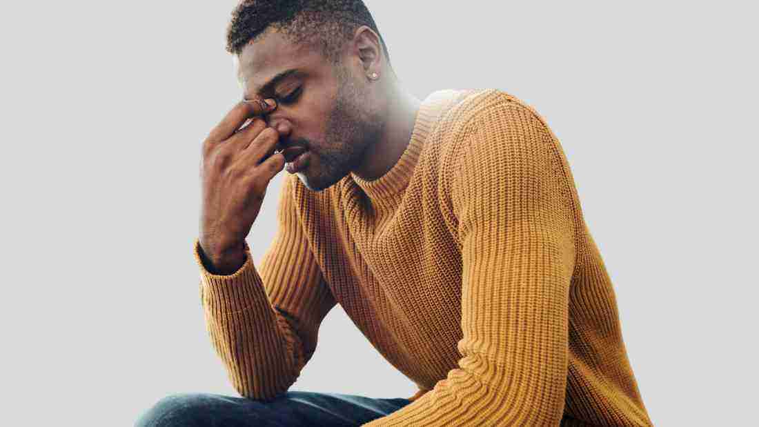 A man who looks totally overwhelmed and distraught