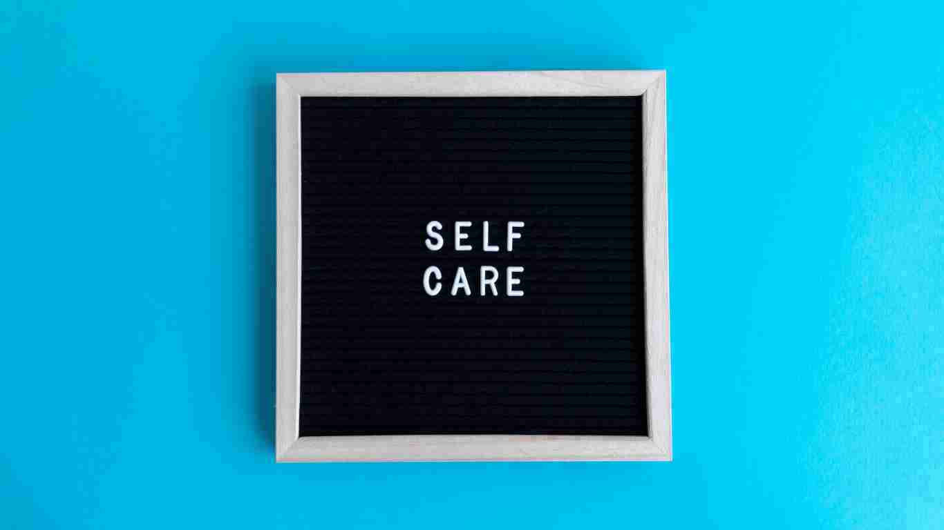 A sign that says SELF CARE