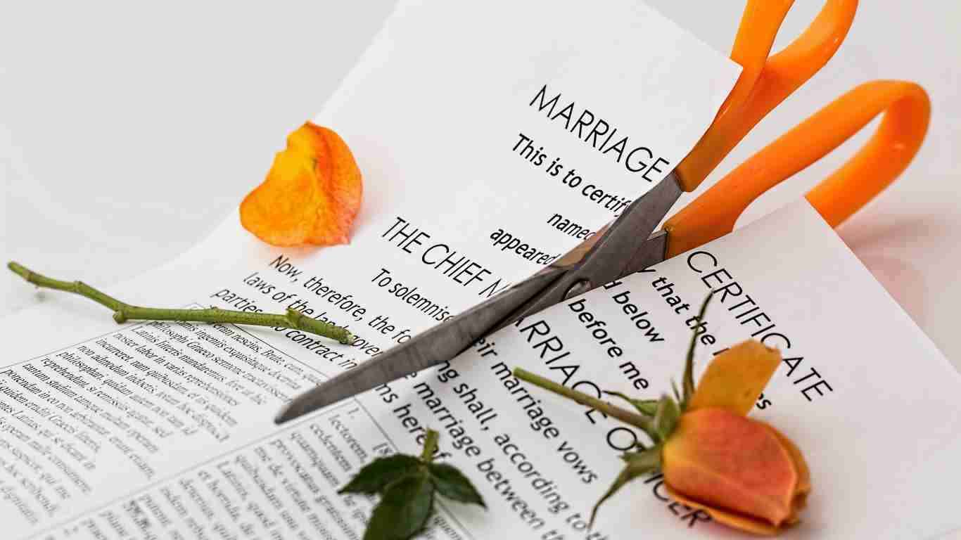 A marriage contract cut in half, symbolizing the ending of the marriage