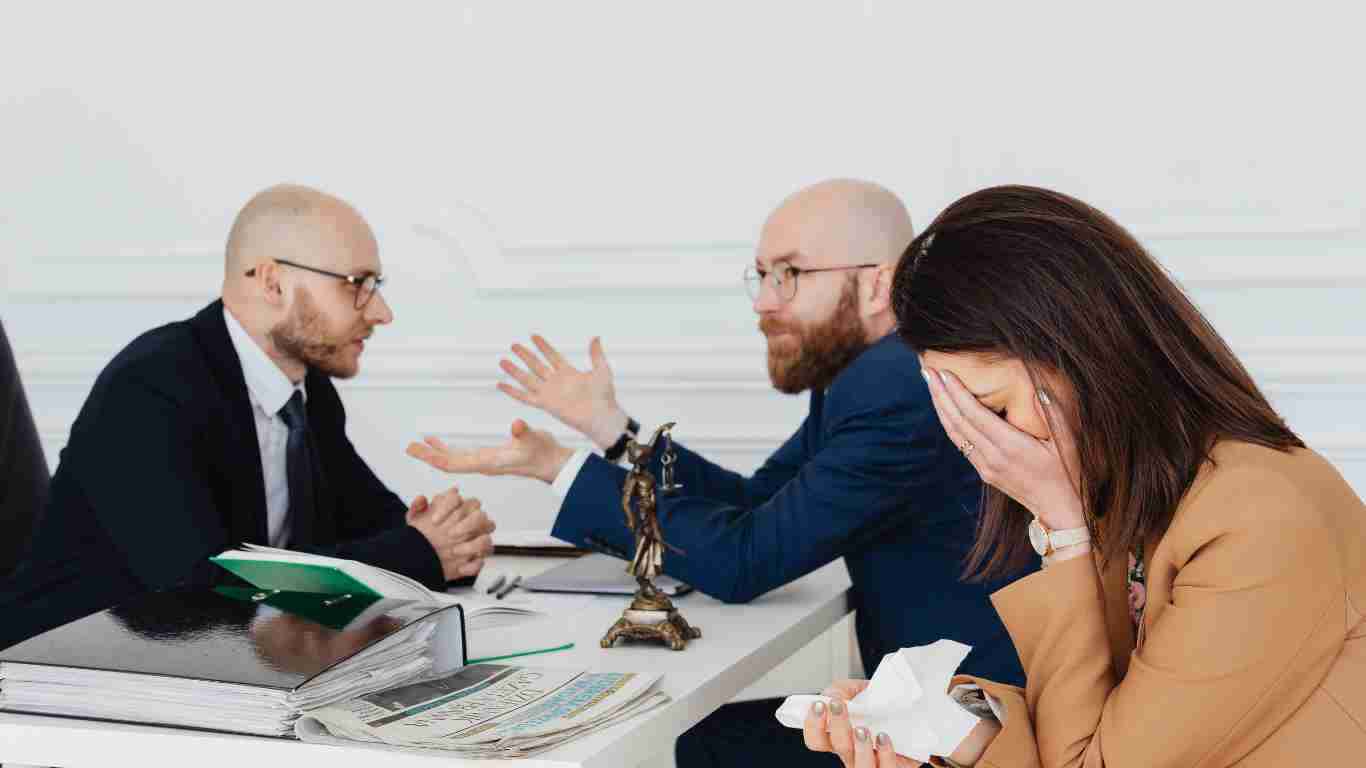 A couple talking to a lawyer discussing their divorce