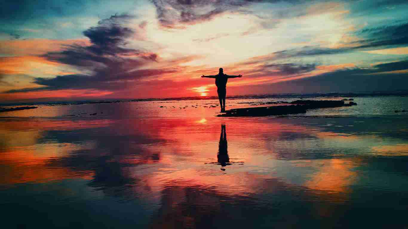 A man walking into the sunset