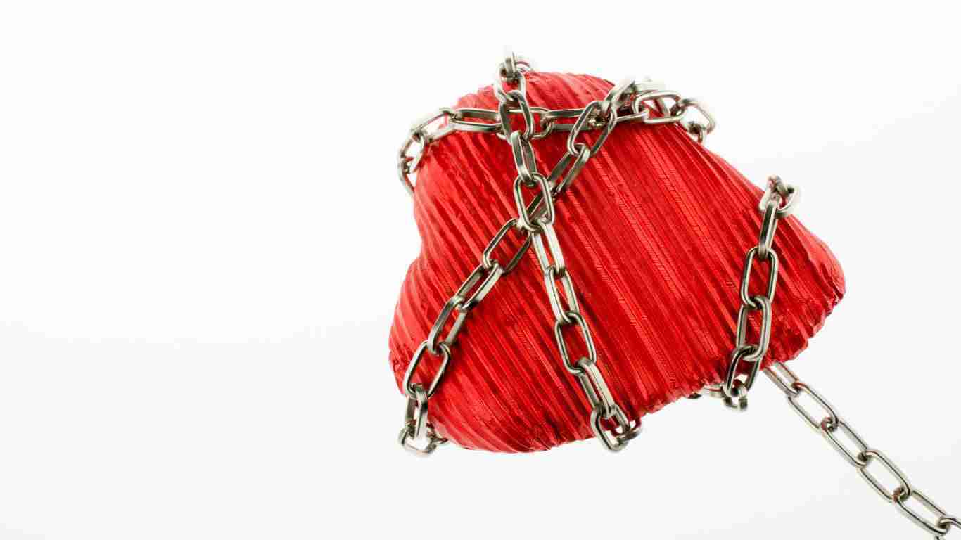 A heart tied up in chains, symbolizing a trauma bond