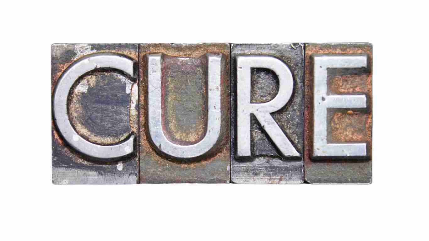 Metal blocks forming the word CURE