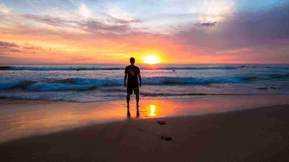 A man enjoying a beautiful sunset