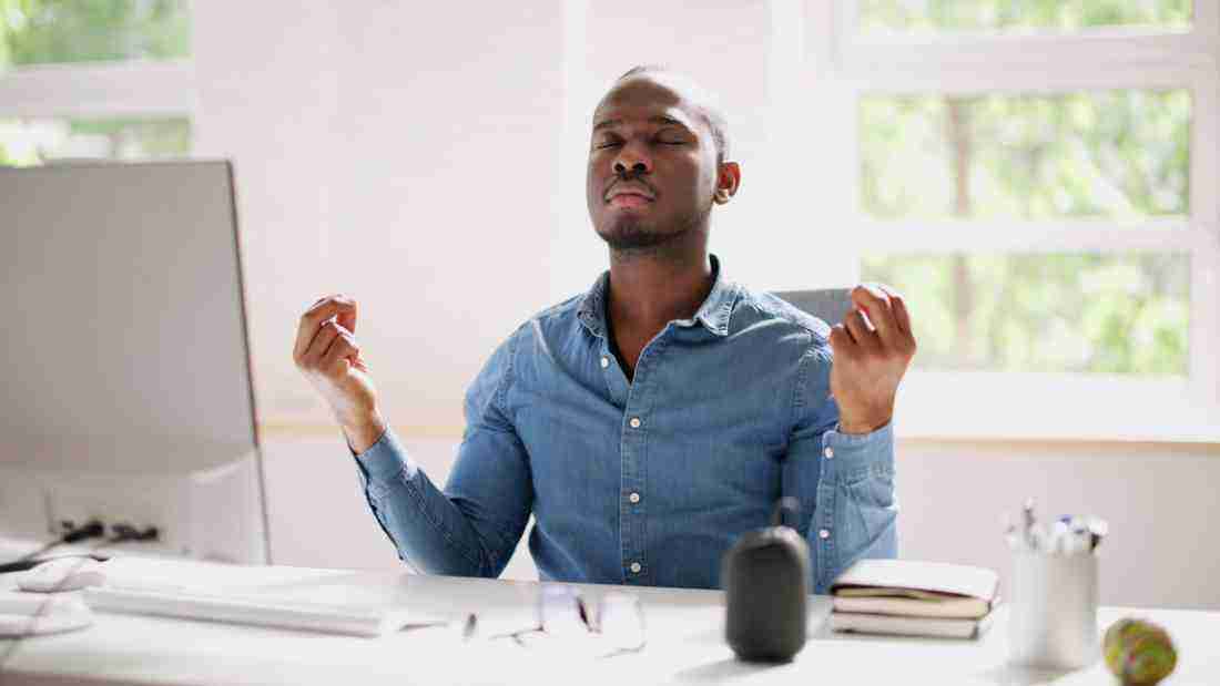 A man controlling his breath in order to calm down