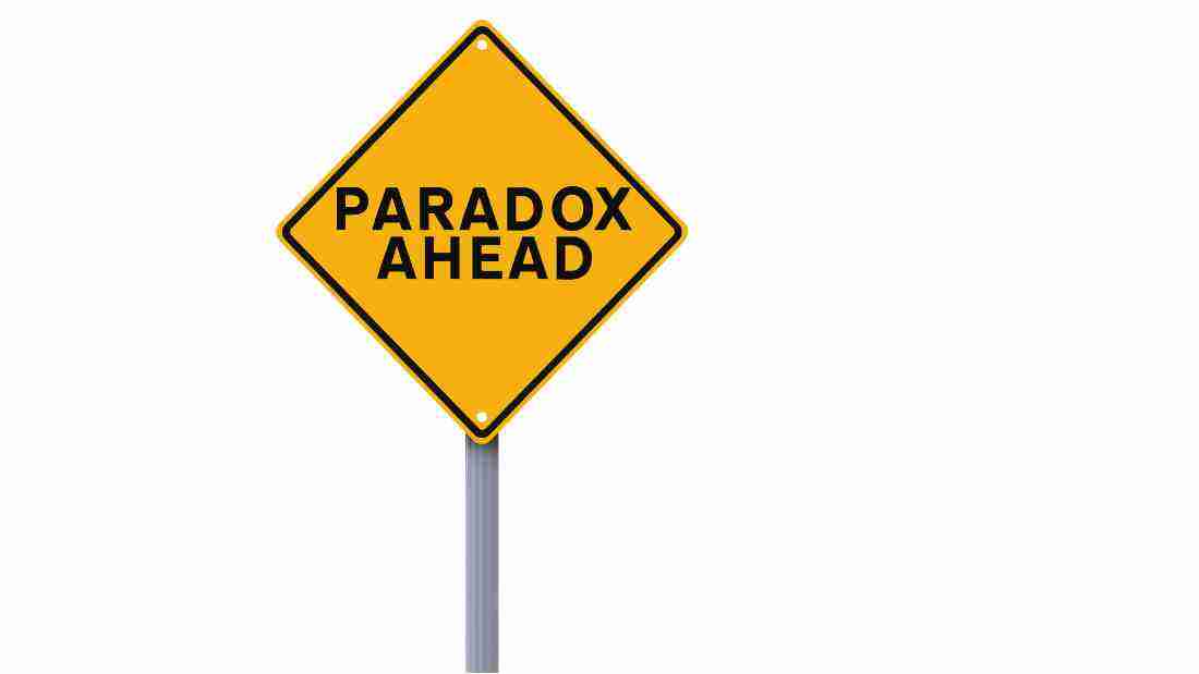 A road sign with the word PARADOX written on it