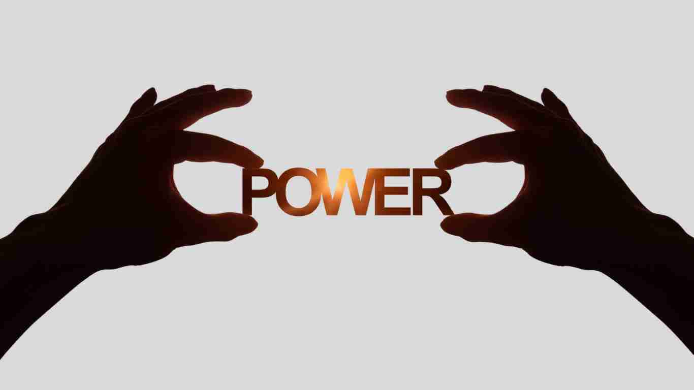 Hands holding up the word POWER