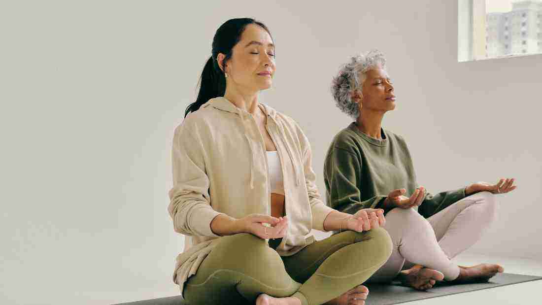 Two ladies meditating