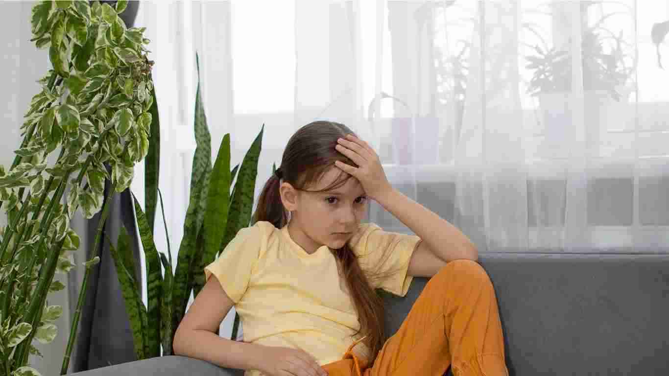A little girl who looks totally overwhelmed and exhausted