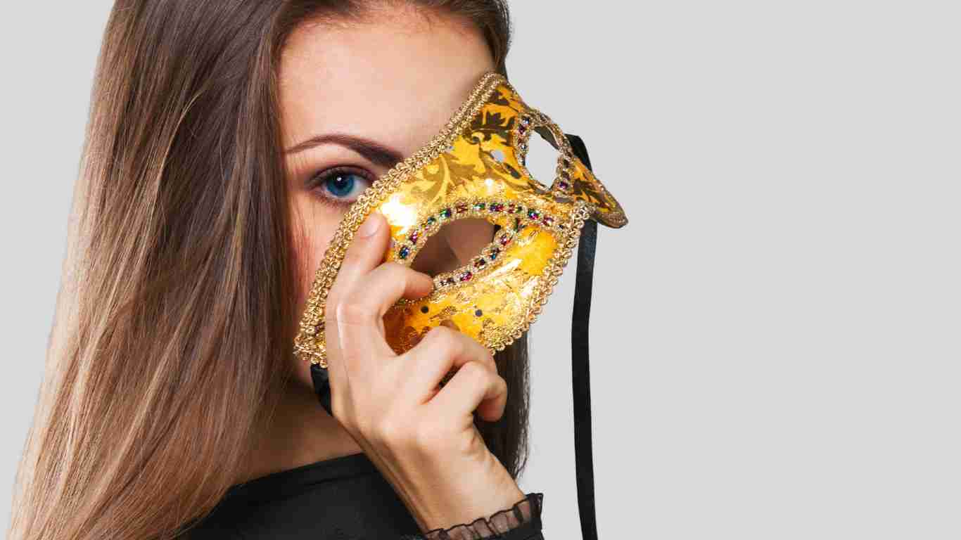 A woman hiding behind a mask