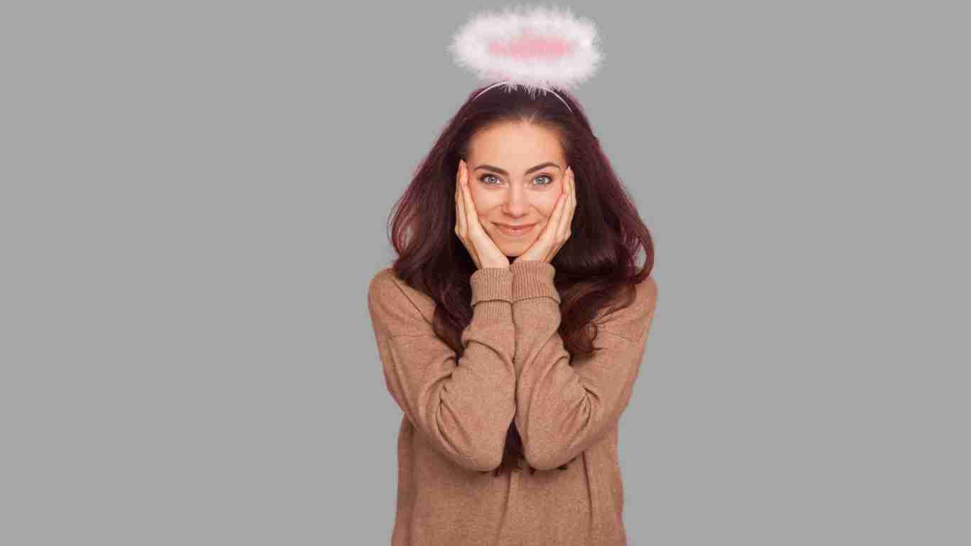 A woman wearing a halo looking like a saint