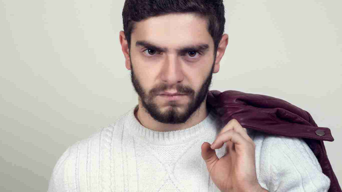 An arrogant man glaring at the camera