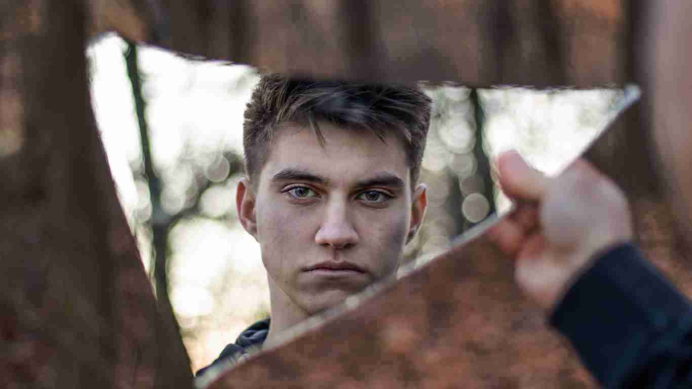 An arrogant narcissist staring in the mirror