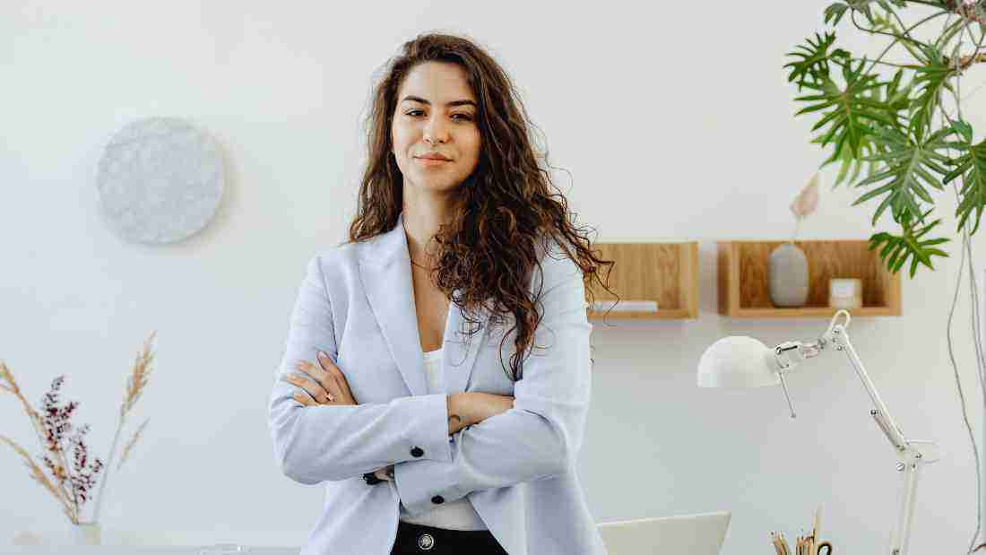 An attractive, confident woman in an office setting