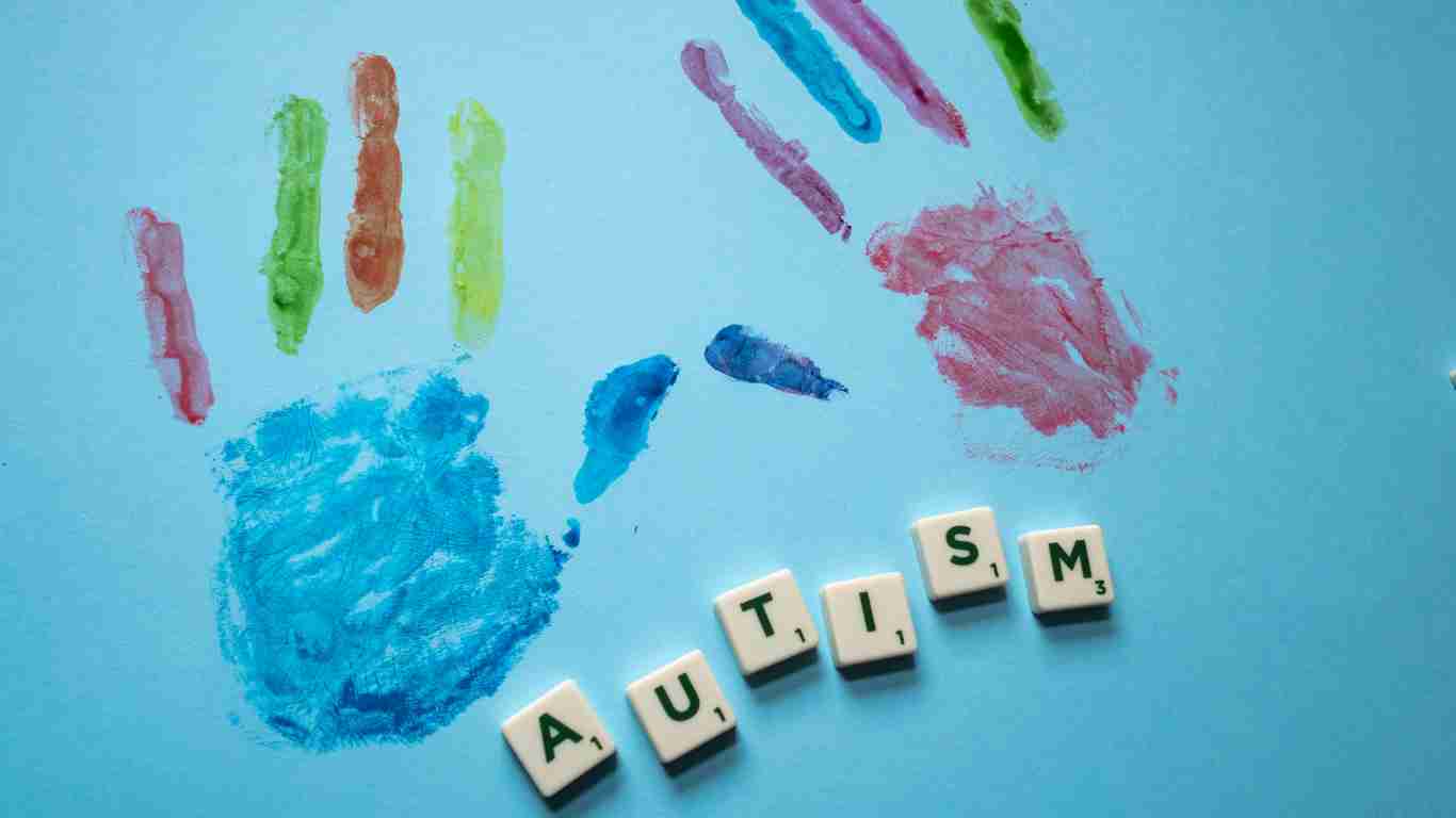 Hand prints and the word AUTISM