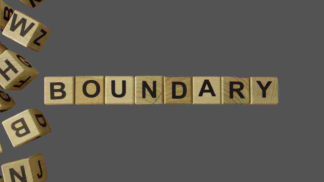 The word BOUNDARY formed out of wooden blocks