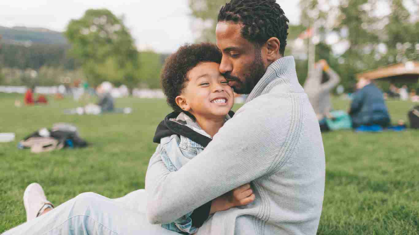 A father hugging her child