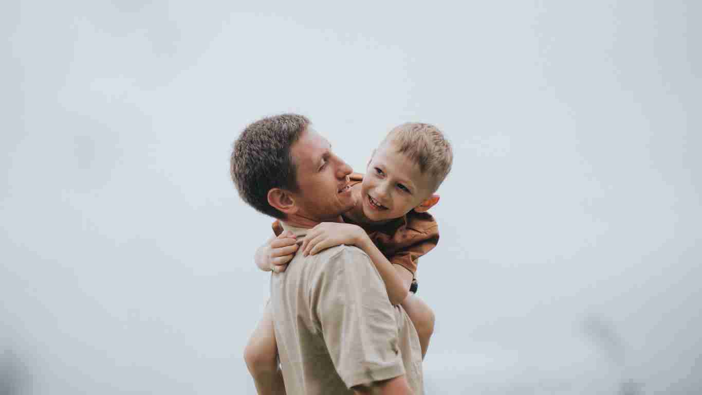 A father hugging his son