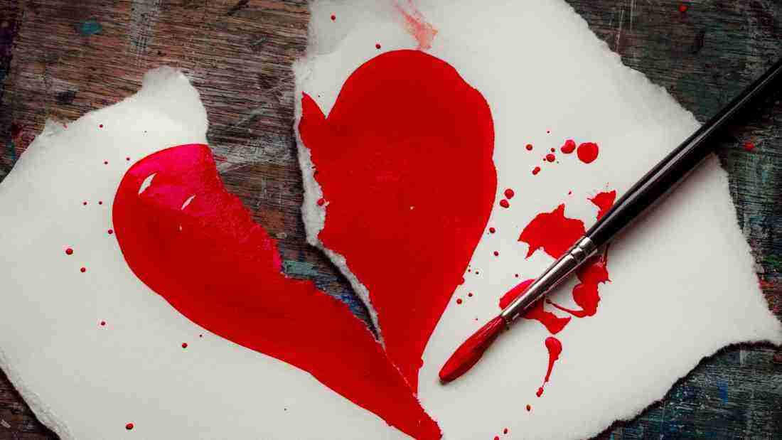 A painting of a heart that is torn in two