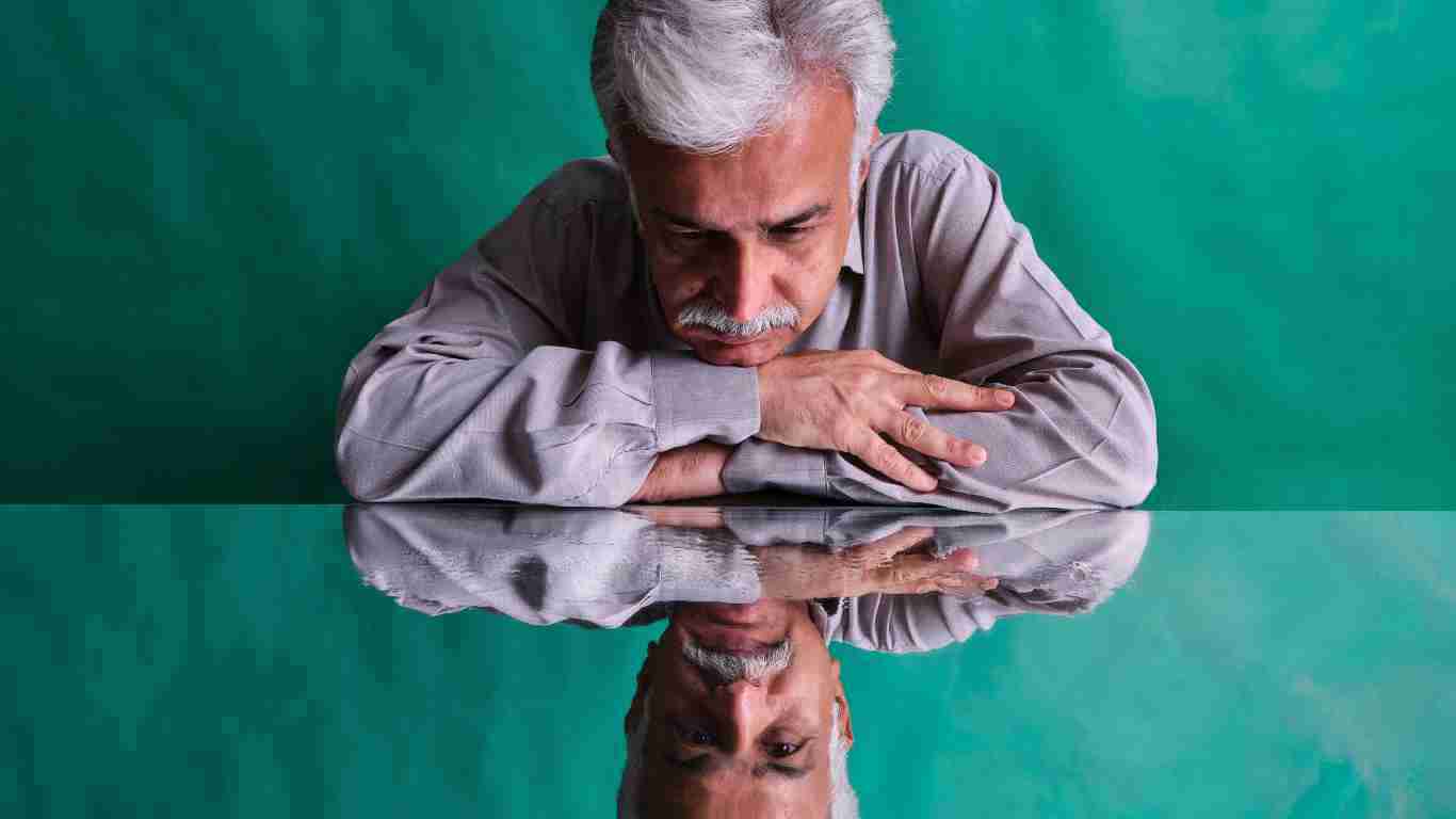 A man staring at his reflection