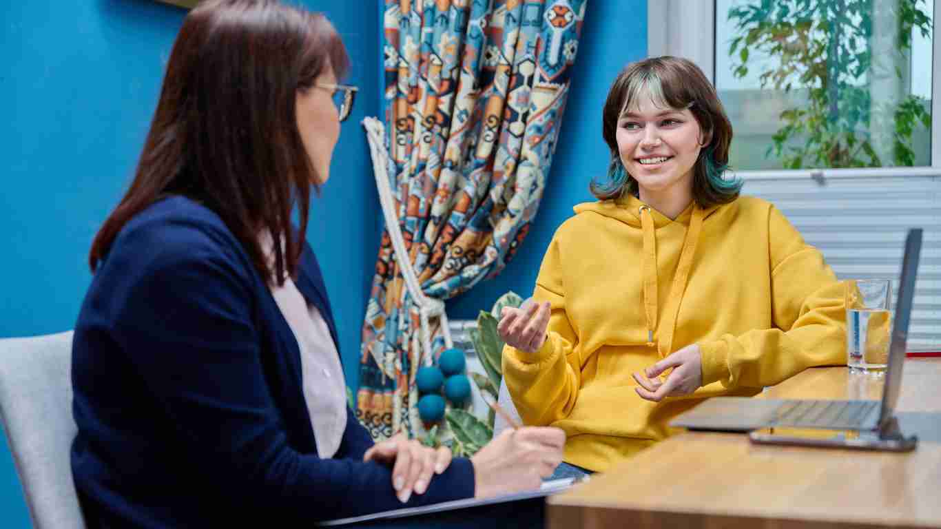A young woman talking to her therapist
