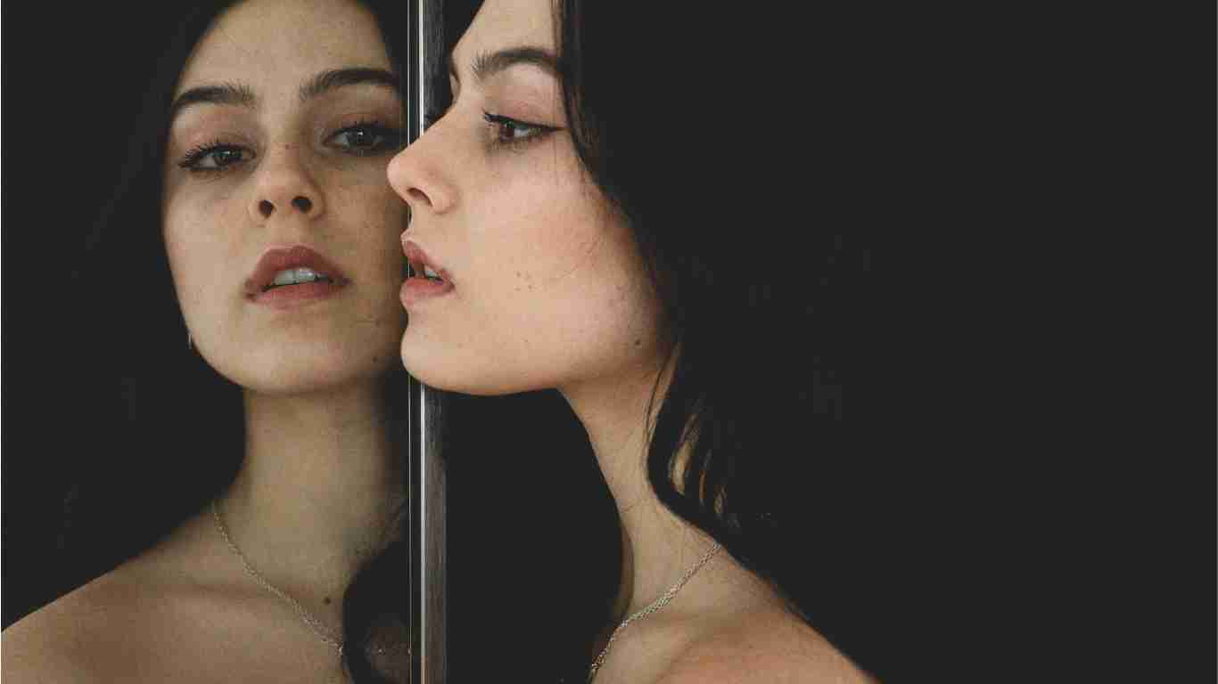 A woman gazing in the mirror